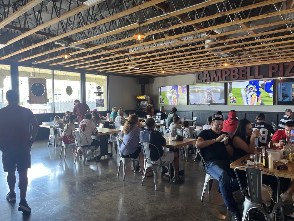 Afternoon dining room with NFL on screens
